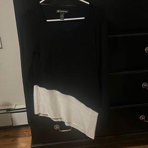 An asymmetrical black and white long sleeved shirt from INC